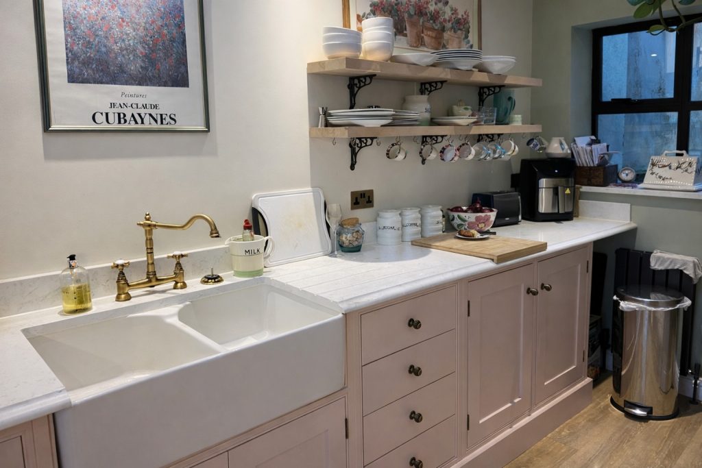Handmade shaker kitchen with butler sink, open oak shelving and quartz worktops in Rickmansworth, Hertfordshire