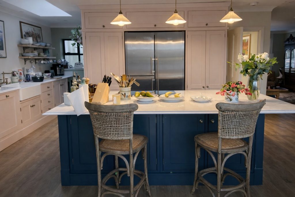 Bespoke shaker-style kitchen island painted in Farrow & Ball Downpipe with quartz worktop and seating in Rickmansworth, Hertfordshire