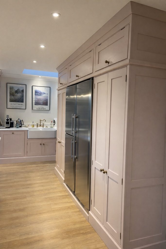 Full view of bespoke shaker-style kitchen painted in Farrow & Ball Setting Plaster in Rickmansworth, Hertfordshire