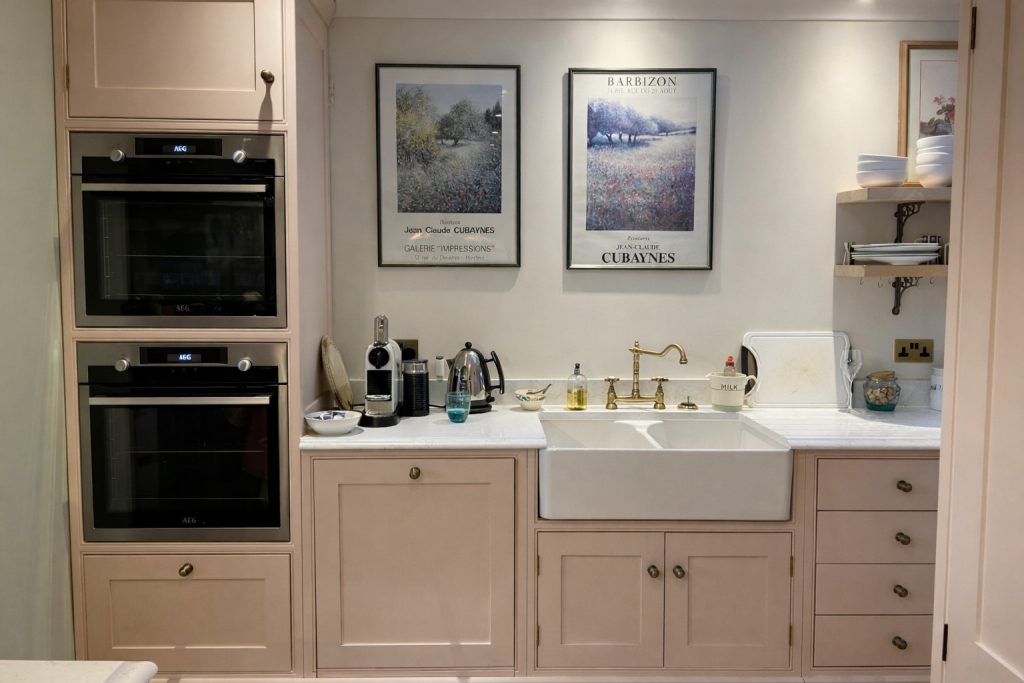 Bespoke shaker-style kitchen with integrated ovens, butler sink and quartz worktops in Rickmansworth, Hertfordshire