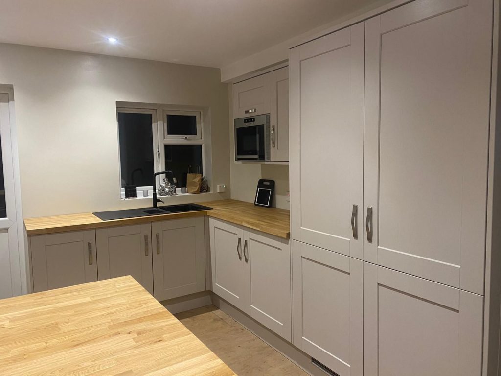 Painted shaker kitchen cabinetry with integrated appliances in Witham, Essex