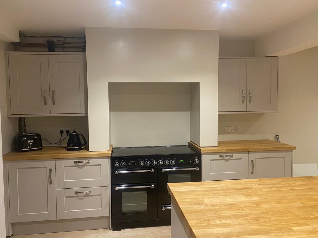 Painted shaker kitchen with range cooker and bespoke overmantel in Witham, Essex