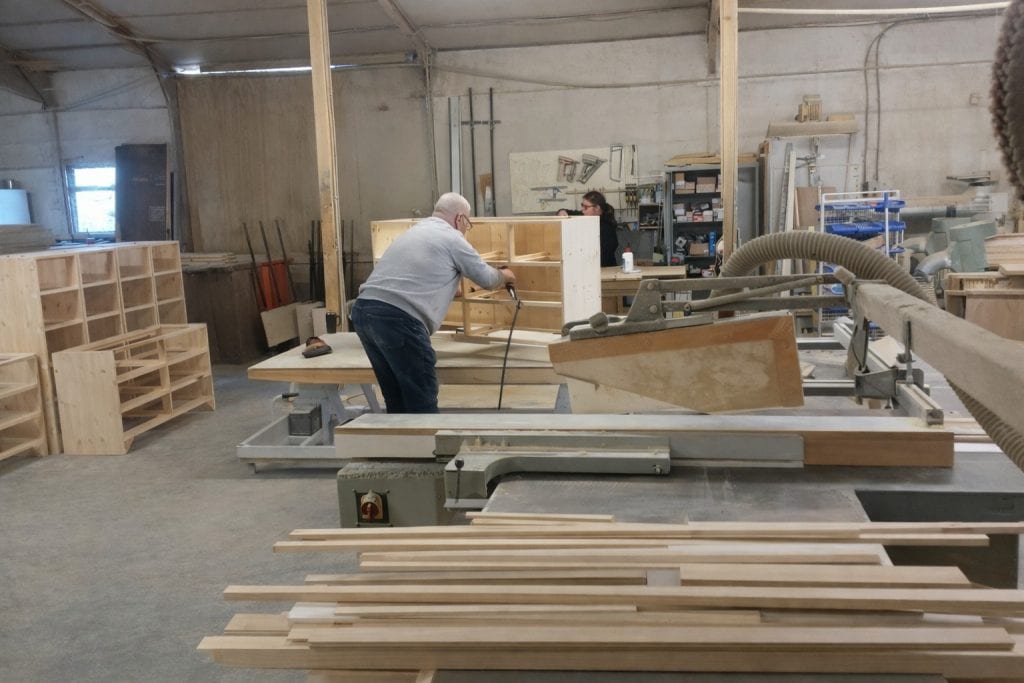 Pine furniture units being assembled in a joinery workshop during manufacture